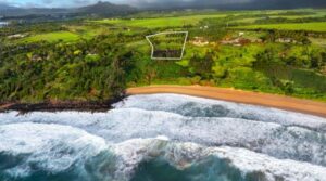 Aerial view from the ocean toward Kealia Kai #18 with an approximate property outline
