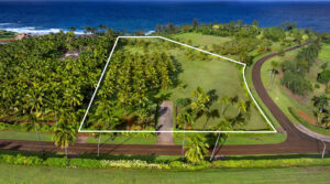 Aerial view of Kealia Kai #18 with an approximate property outline and ocean beyond