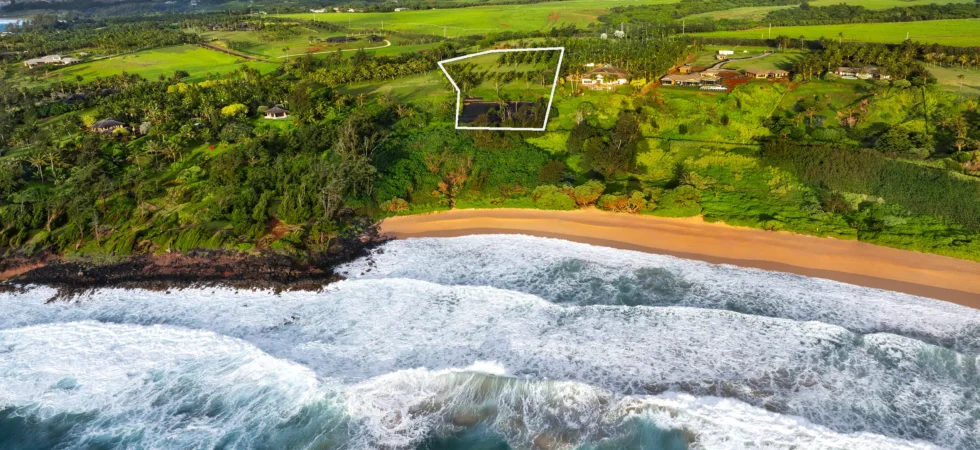 Aerial view from the ocean toward Kealia Kai #18 with an approximate property outline